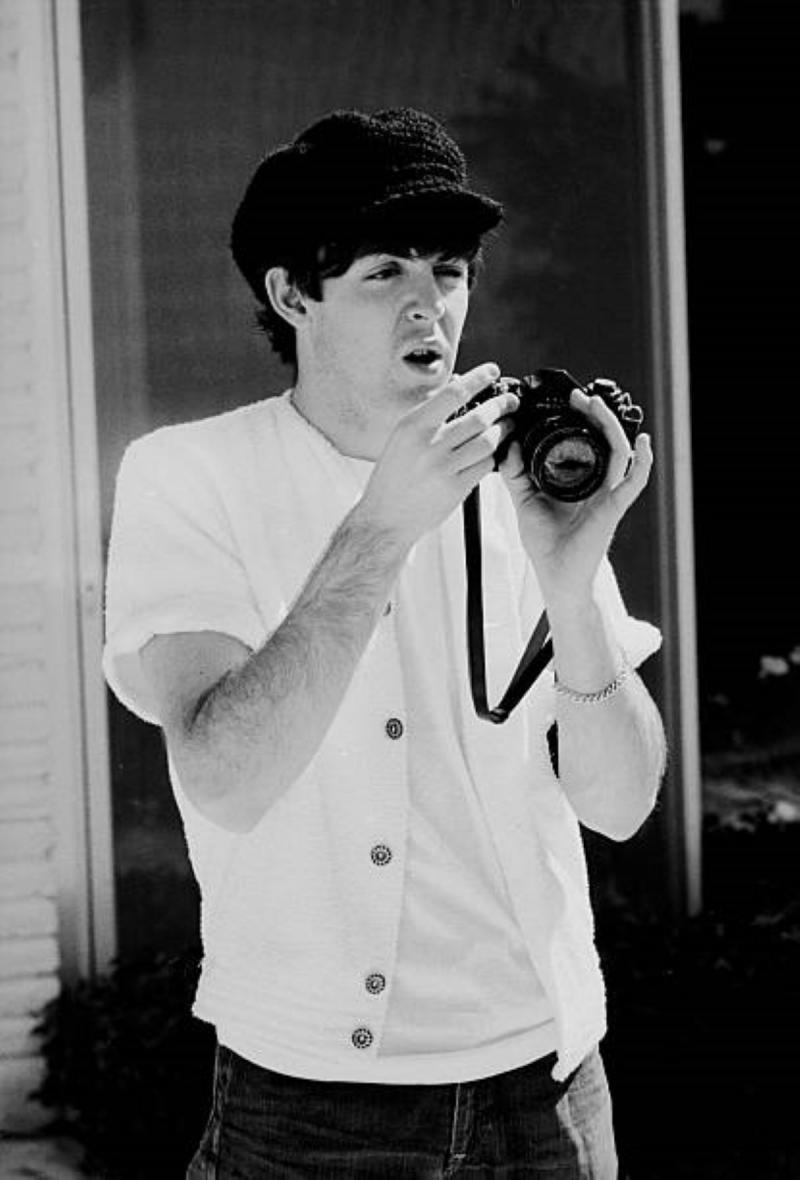Photo: Paul McCartney of the Beatles holds a camera as he prepares to photograph, Miami Beach, Florida, February 1964 Archival Pigment Print #2781