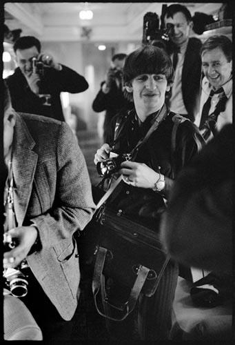Ringo with Press Photographer's Gear. Train to D.C. Feb 10, 1964.  Copyright Bill Eppridge<br/>