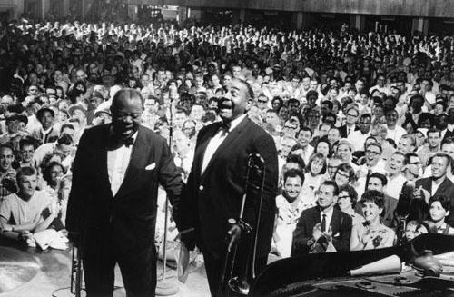 Louis Armstrong and Tyree Glenn performing<br/>