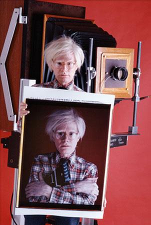 Andy Warhol with Polaroid Camera, NY, 1980<br/>