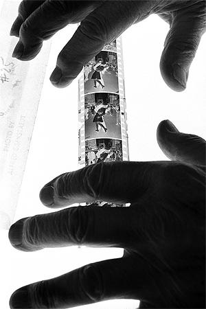 Alfred Eisenstaedt holds his negative of VJ-day celebrants New York City, 1992 Gelatin Silver print