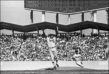 1963 World Series Final Game - Sandy Koufax (jumping/celebrating), Maury Wills, Dodger Stadium, Los Angeles, CA<br/>