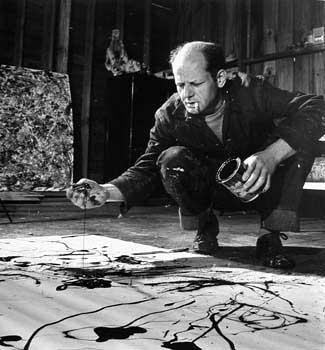 Jackson Pollock Painting in his Studio, Springs, NY, 1949 by Martha Holmes<br/>