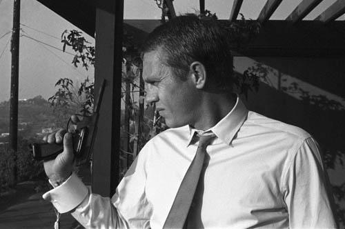 Photo: Steve McQueen with pistol at his Hollywood Hills home, 1961 Gelatin Silver print #1576