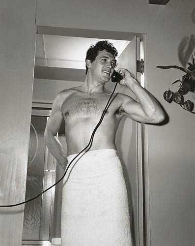 Rock Hudson on telephone at home, 1952