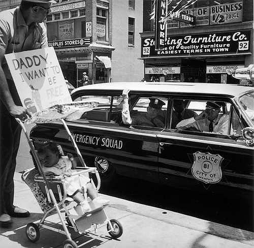 William Edwin Jones pushes daughter Renee Andrewnetta Jones (8 months old) during protest march on Main St., Memphis, TN (The little girl grew up to become a doctor) August, 1961<br/>