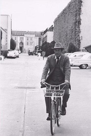 Photo: Rex Harrison on bike going to set of "Mt Fair Lady", 1963 Gelatin Silver print #1816