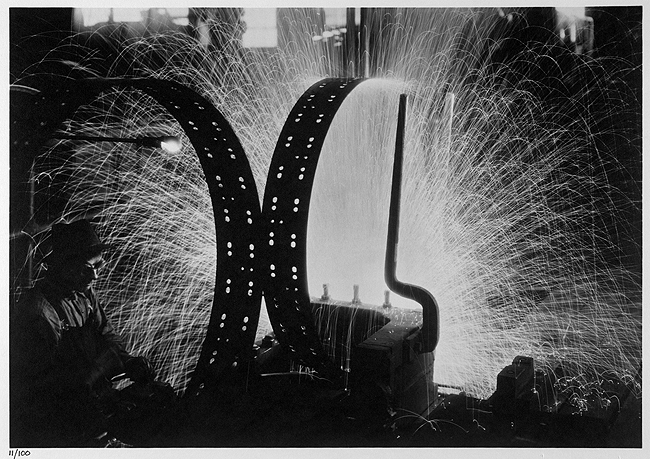 Welding tire rims, International Harvester, Chicago, IL, 1933