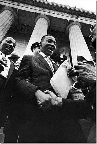 Paul Schutzer - Martin Luther King smiles and shakes hands after address at the Lincoln  Memorial. "Prayer Pilgrimage for Freedom", Washington, DC 1957<br/>