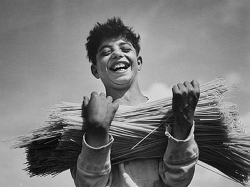 Boy with dried spaghetti, Naples, Italy, 1934<br/>