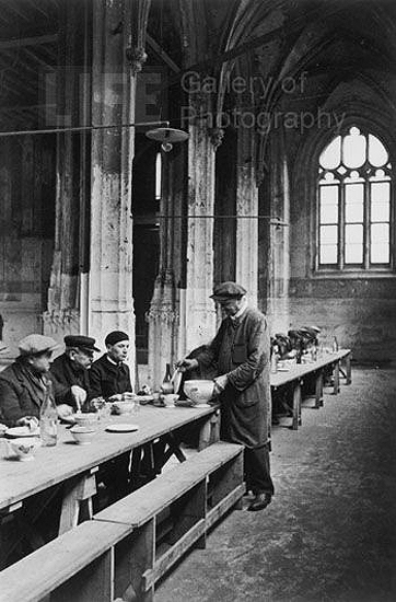 Destitute men being fed in the Notre Dame Cathedral, Rouen, France, 1931