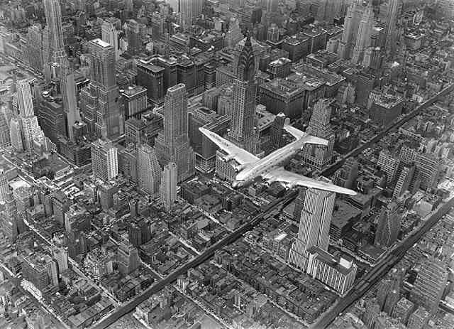 A DC4 Flying Over New York City (?Time Inc.)