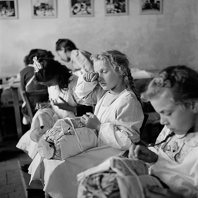 "Tired Eyes". Orphans in a sewing class, Trieste, Italy, 1947