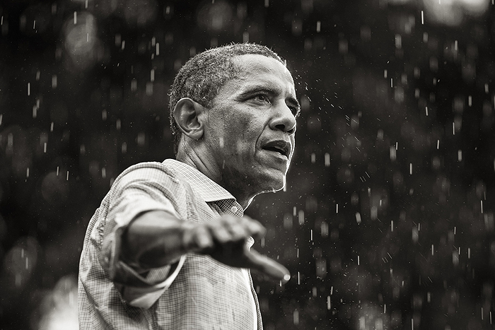 U.S. President Barack Obama speaks in the rain during a campaign rally in Glen Allen, Virginia, 2012