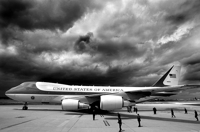 Storm clouds loom overhead as Air Force One and U.S. President George W. Bush arrive in Paris