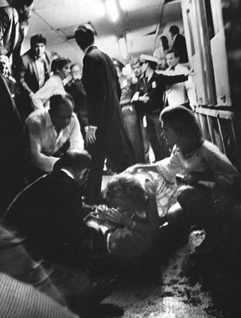 Ethel speaking to her husband Robert as Jean Kennedy Smith kneels nearby, Ambassador Hotel kitchen, June 5, 1968