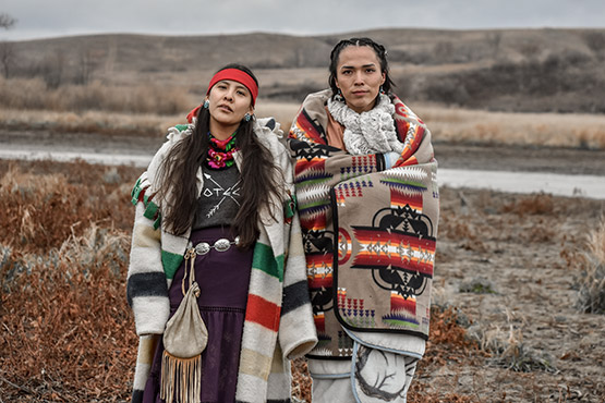 Two Dine woman hold strong in sovereignty, only speaking their ancestral language at Turtle Island, Thanksgiving, 2016