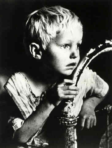 Boy Sitting on a Bed in Oil Boom Town of Freer, Texas, 1937 (Life Magazine/Time Warner Inc.)