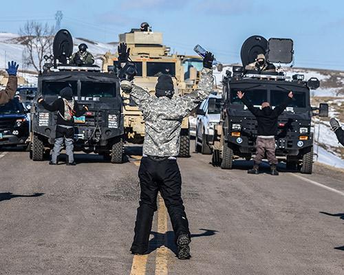 Ryan Vizzions 3 water protectors use their bodies to keep law enforcement vehicles from ascending on Last Child Camp, February 1, 2017 