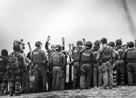 Religious leaders being arrested for peacefully protesting the immigration policies of the Trump administration, on the border near San Diego, California, December 10, 2018 Archival Pigment Print