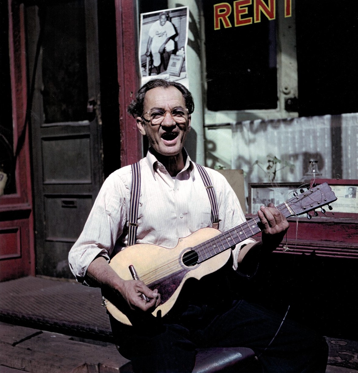 Man with guitar, East Harlem, New York, 1947