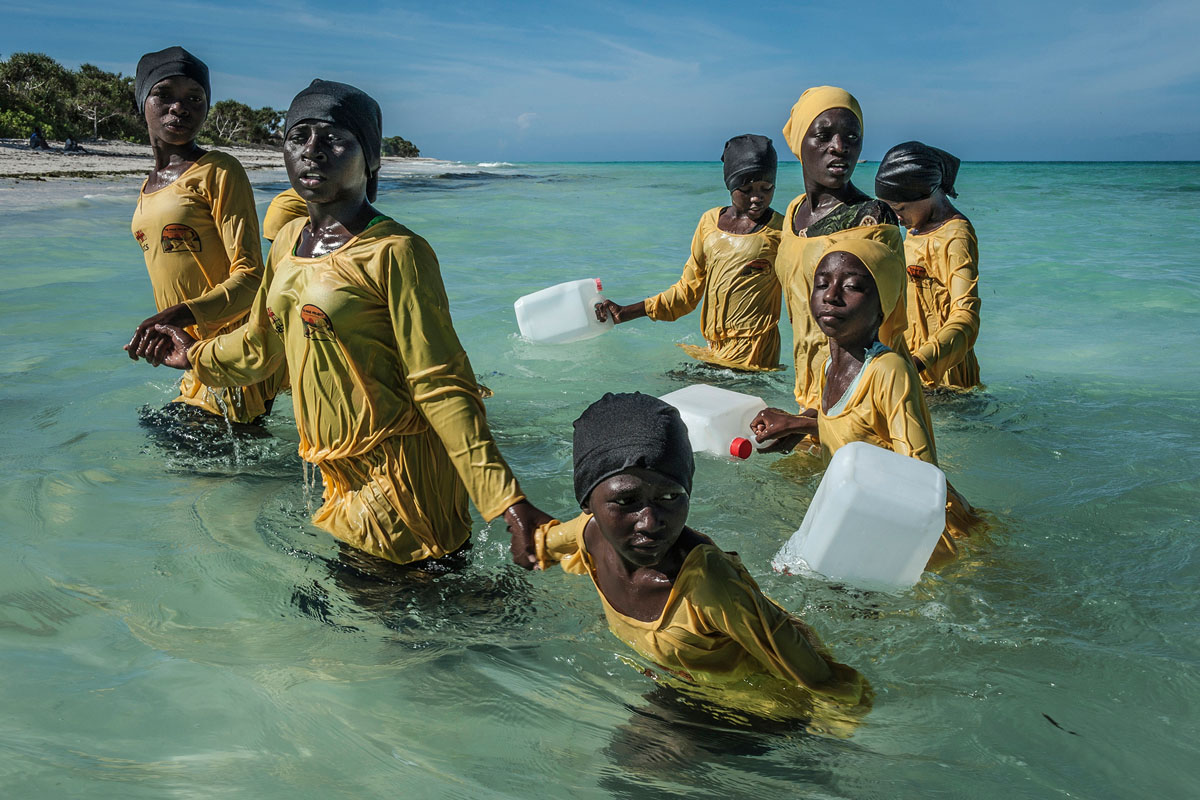 Kijini Primary School students walk to shore after a swimming lesson, Muyuni Beach, Zanzibar, 2016