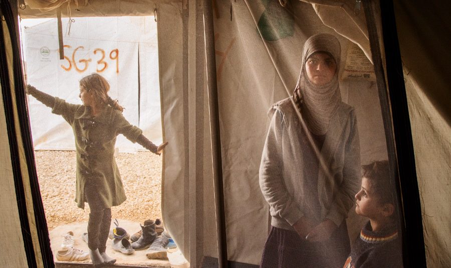 Reem, 13, spends time with her her siblings in her family tent at the Al Za’atri refugee camp near Mafraq, Jordan, 2013. With nearly 200,000 people, Al Za’atri is now the second largest refugee camp in the world.
