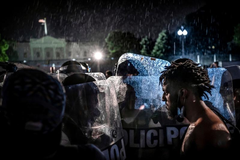 Photo: May 30, 2020. A man faces off with Secret Service agents in riot gear outside the White House n the first night of demonstrations in Washington over the death of George Floyd Archival Pigment Print #2623