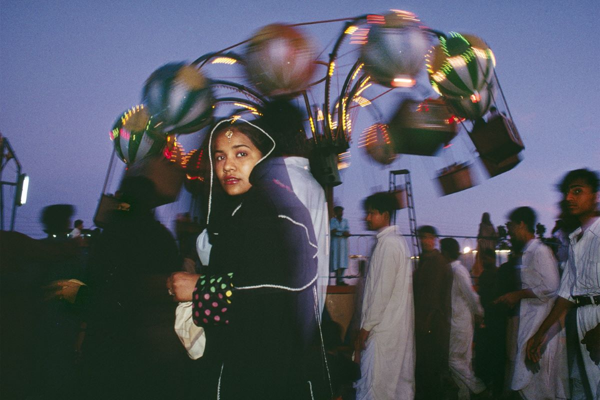 Sightseers visit the colorful Clifton Beach Amusement Park on Karachi, Pakistan, 1998