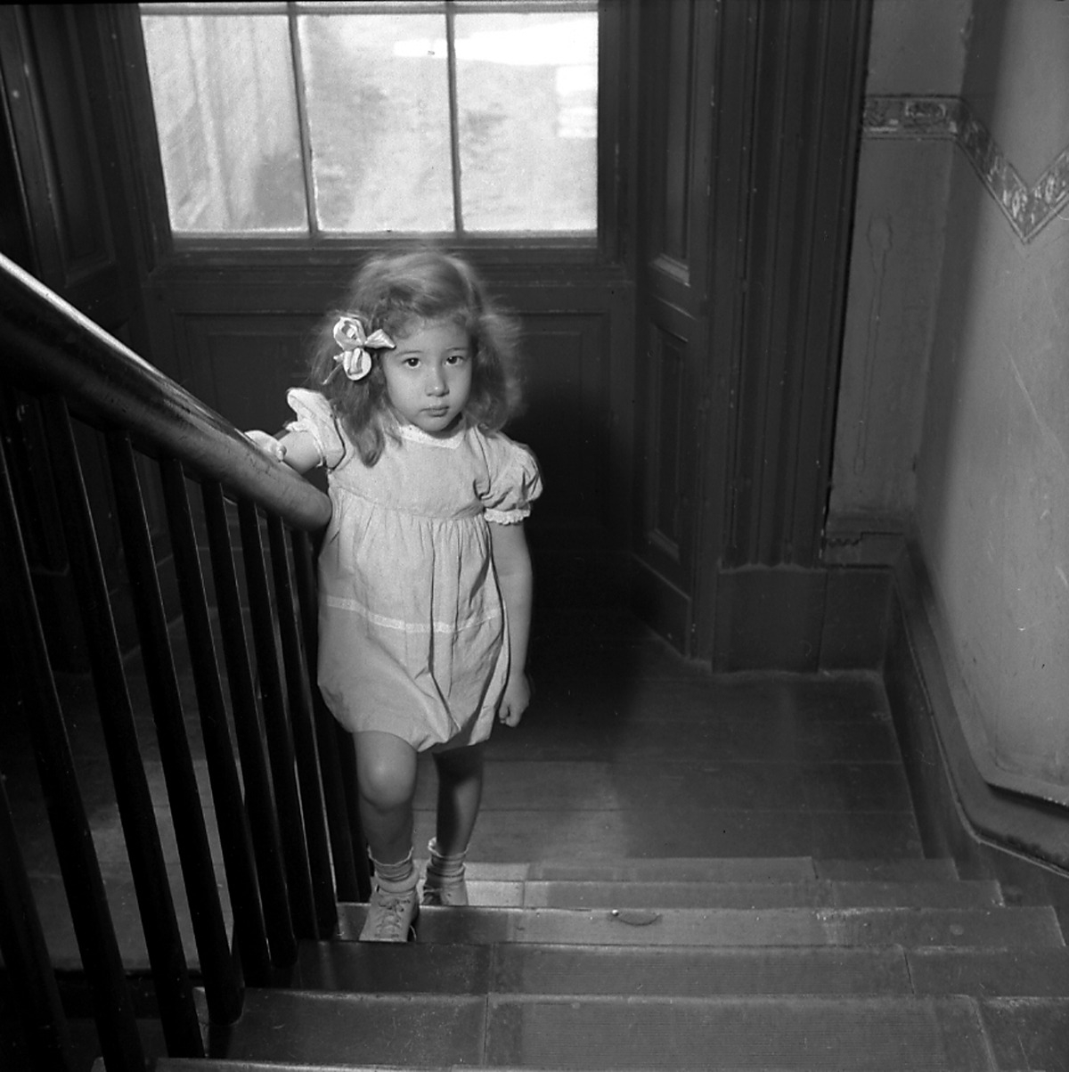 Girl on stairs, New York City, c. 1946-1950