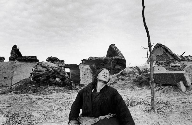 Carl Mydans Woman Mourning in the Ruins Near Pengpu During the China Wars,.1948  Please contact Gallery for price
