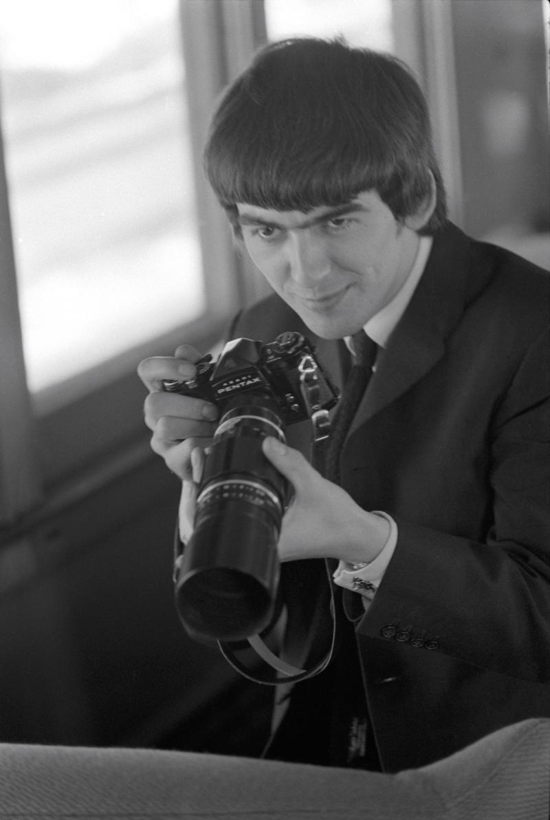 George Harrison with camera, 1964<br/>Please contact Gallery for price