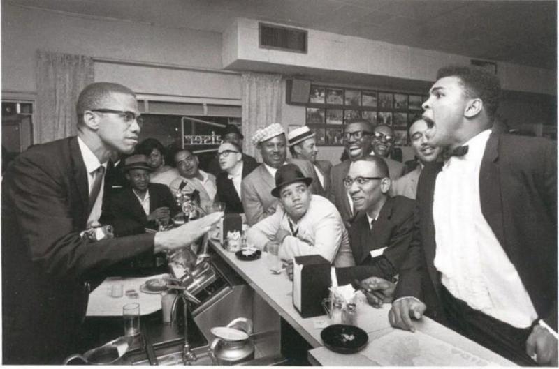 Malcolm X and Muhammad Ali in an animated discussion, Miami, 1964<br/>Please contact Gallery for price