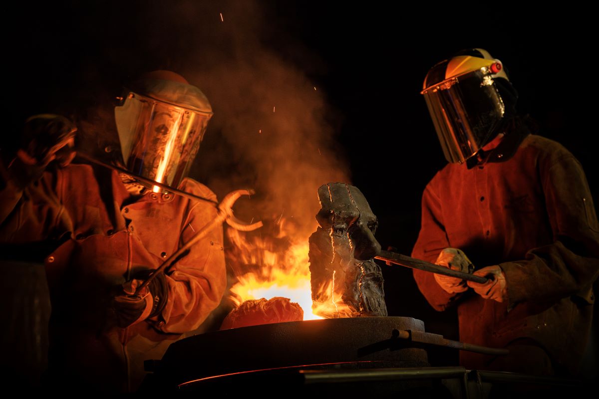 Foundry workers prepare to melt down the face of the Robert E. Lee statue for repurporsing, October, 2023