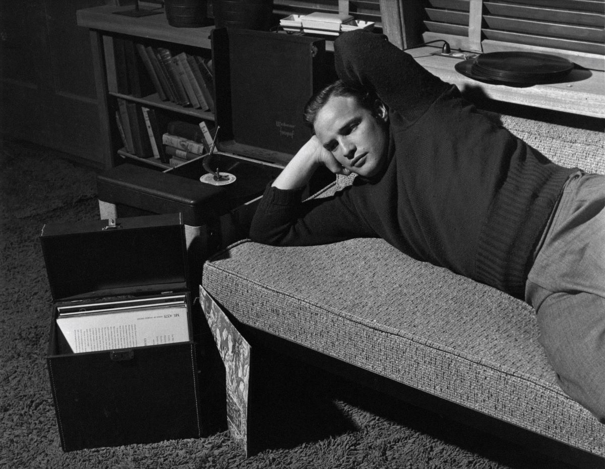 Marlon Brando listening to records at home, Los Angeles, 1953