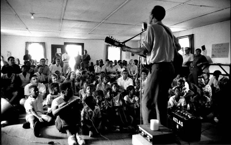 Folk singer Pete Seeger performing for a Meridian, Mississippi church congregation where he got word that the bodies of missing civil rights workers Andrew Goodman, Michael Schwerner and James Chaney had been found, August, 1964<br/>Please contact Gallery for price