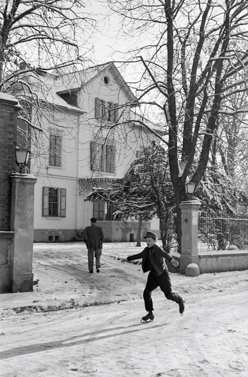 Photo: A boy ice skating in the street, Pfungstadt, Germany, January 1947 Archival Pigment Print #2907