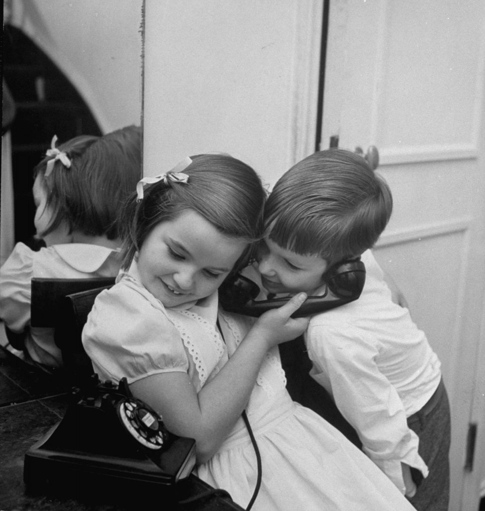 Calling Santa, 1947: Bann Kernan, who is 7 years old, squirms with delight as she asks Santa for a wrist watch. Moments later she gave the phone to her younger brother, Bennie, 5, who requested a train