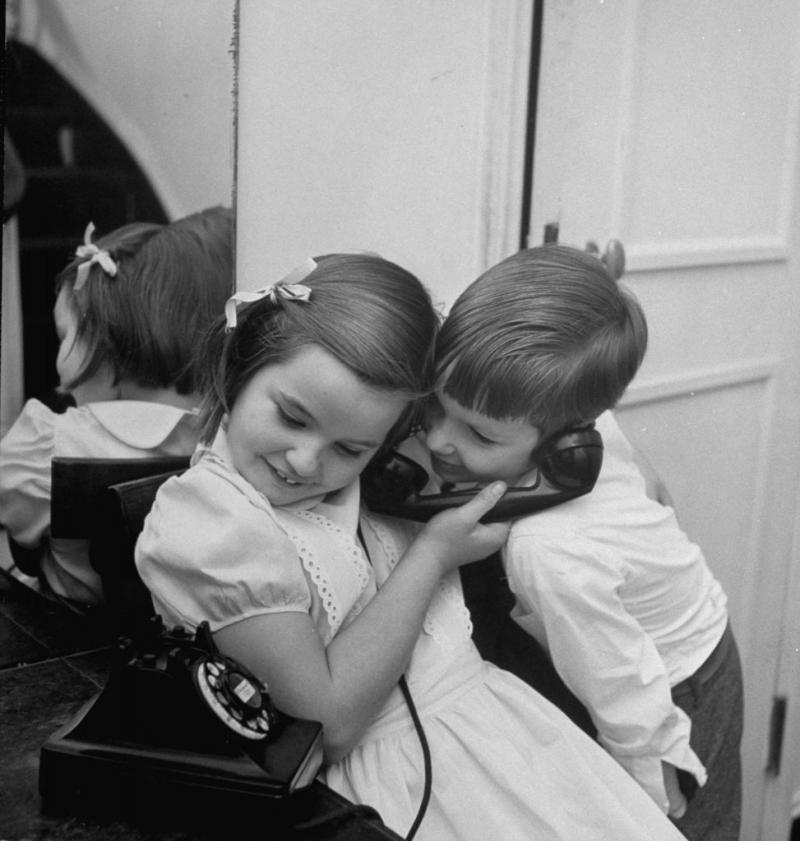 Photo: Calling Santa, 1947: Bann Kernan, who is 7 years old, squirms with delight as she asks Santa for a wrist watch. Moments later she gave the phone to her younger brother, Bennie, 5, who requested a train Gelatin Silver print #2925