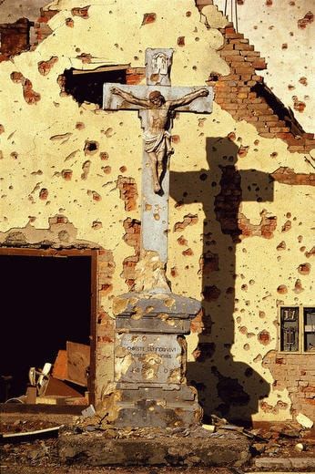 A destroyed Roman Catholic cross in Vukovar, Croatia, 1991