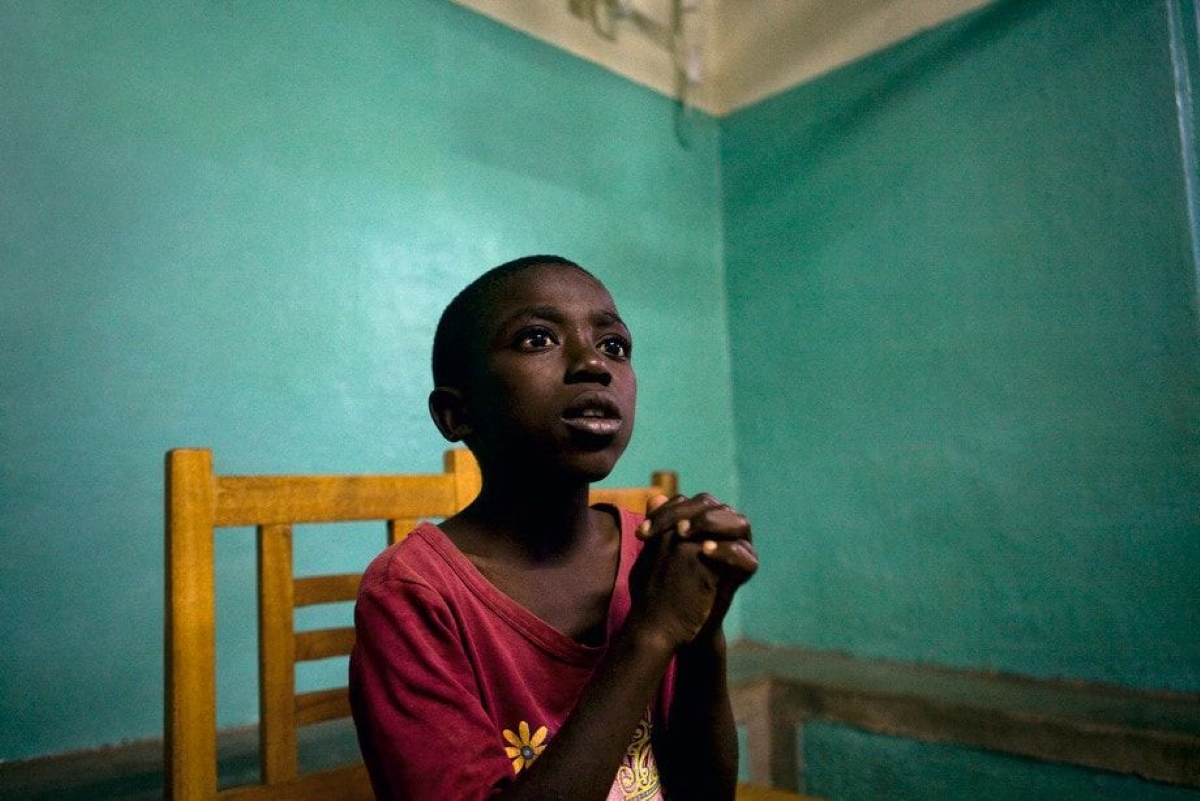 Ozias Kambale Pimo, 11 who was separated from his parents during a battle is told his parents  are still alive by the International Committee of the Red Cross. Democratic Republic of Congo 2009