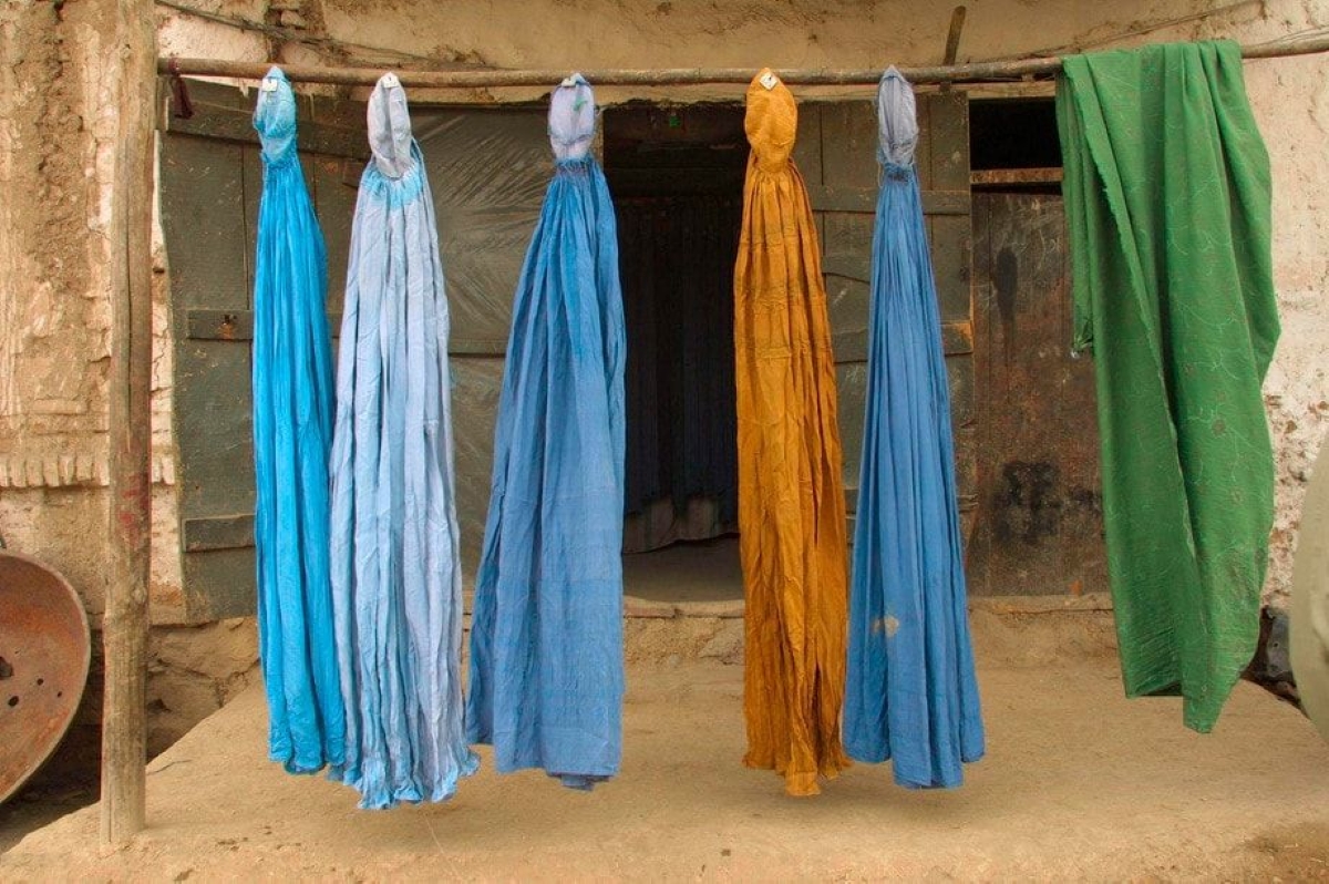 Burqas dry outside on a street. Kabul, Afghanistan 2001