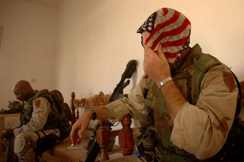 Photo: A soldier takes a break after 36 hours of searching over 1,000 homes in southern Samarra, 2004  #3023