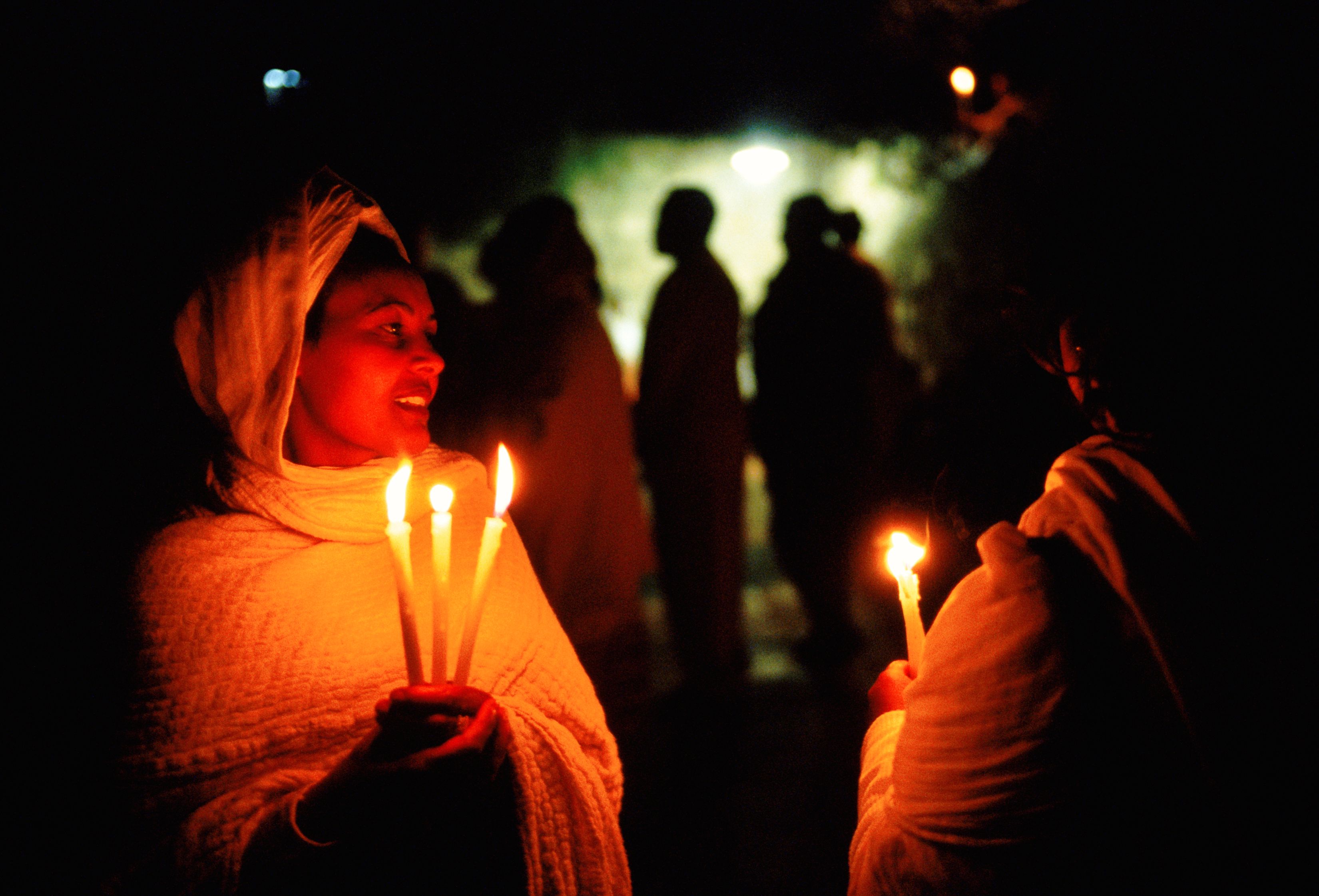 Coptic Christians hold a nighttime ceremony at the Church of the Sepulchre. Jerusalem 1999