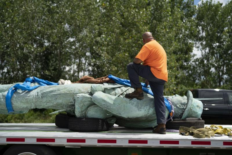 Photo: A worker stands with downed statue of Stonewall Jackson Archival Pigment Print #3046