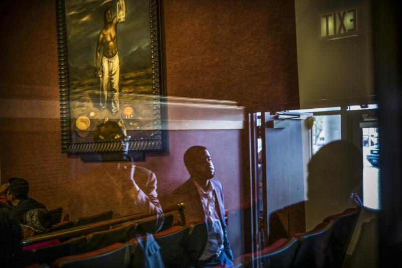 Photo: Men wait for the arrival of former president Bill Clinton at a church where he will speak on behalf of his wife Hillary Clinton shortly before the 2016 presidential election. Columbus, Ohio 2016. Archival Pigment Print #3083