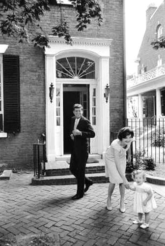 John, Jacqueline, and Caroline Kennedy outside their Georgetown house, 1959