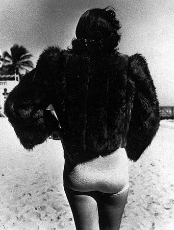 Woman wearing fur jacket during cold spell, Miami Beach, Florida, 1940