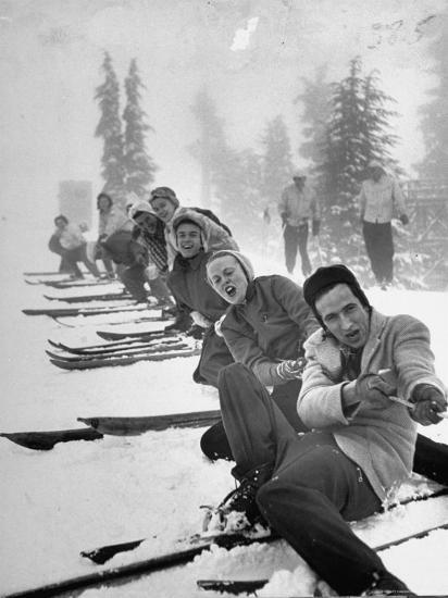 Ralph Morse: Playing tug-of-war during snowstorm at Timberline Lodge Ski Club party,1942 by Ralph Morse<br/>Please contact Gallery for price