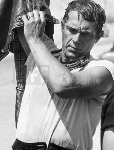 Steve McQueen after motorcycle race, Mojave Desert, 1963